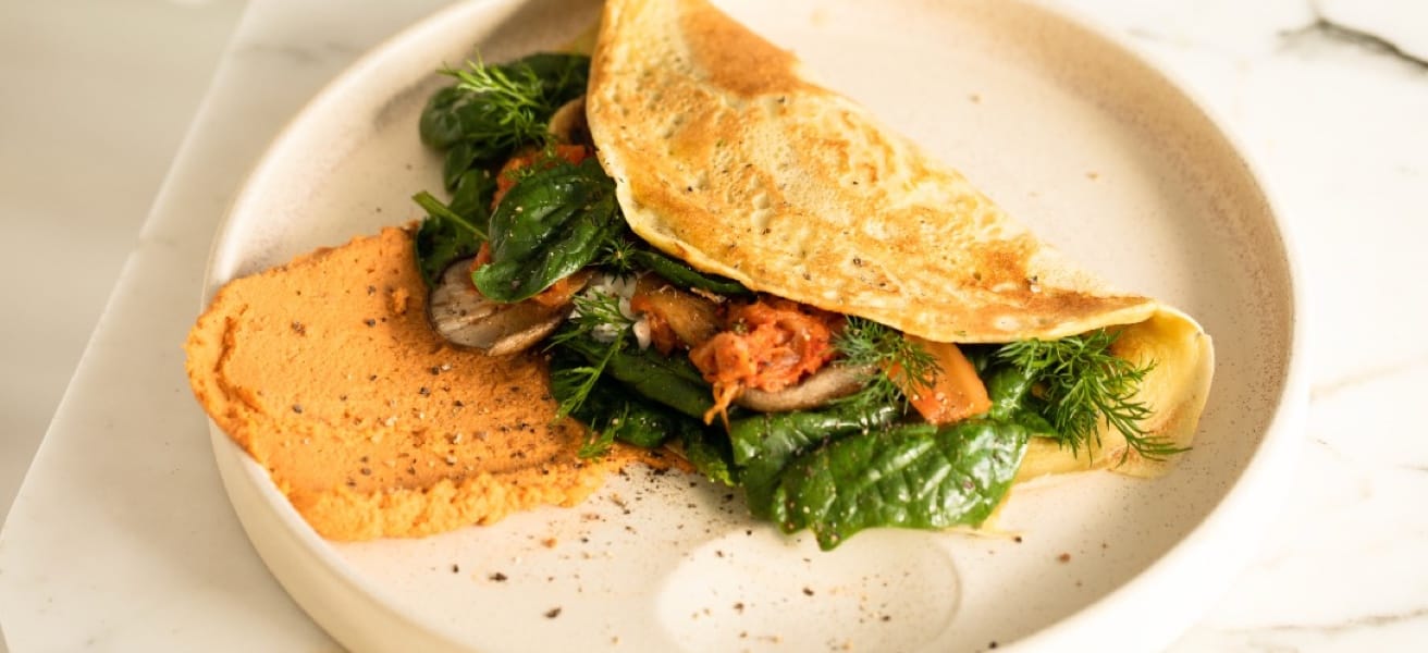 an omelette accompanied by some mashed pumpkin